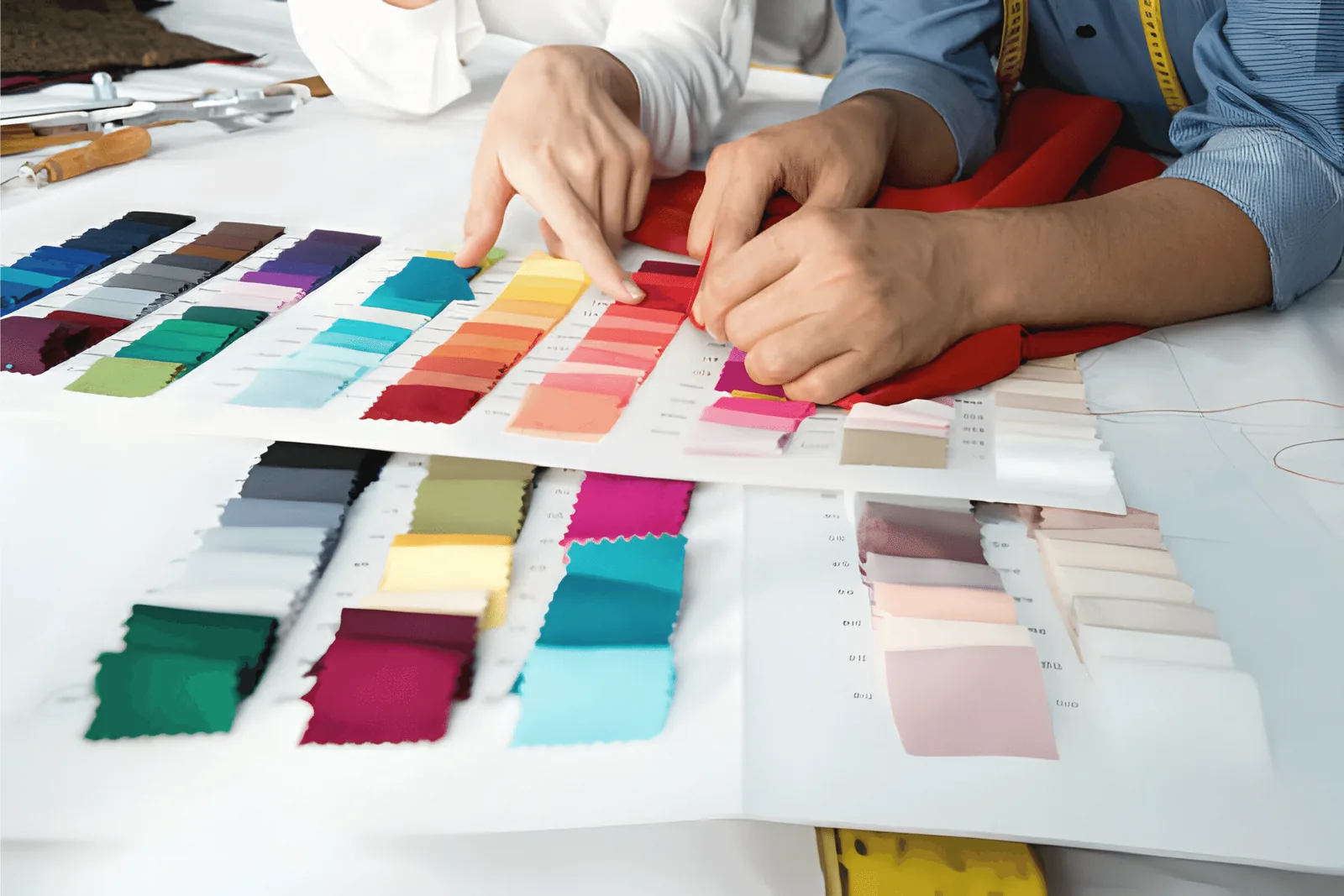 Designer selecting fabric swatches in a range of colours for a sustainable clothing collection