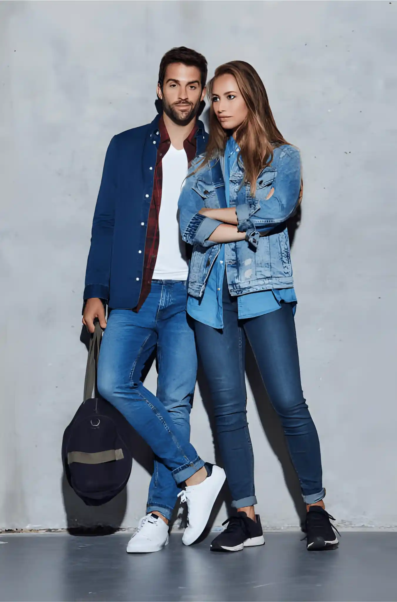 Male and female models wearing denim jacket and pants in a studio shoot.