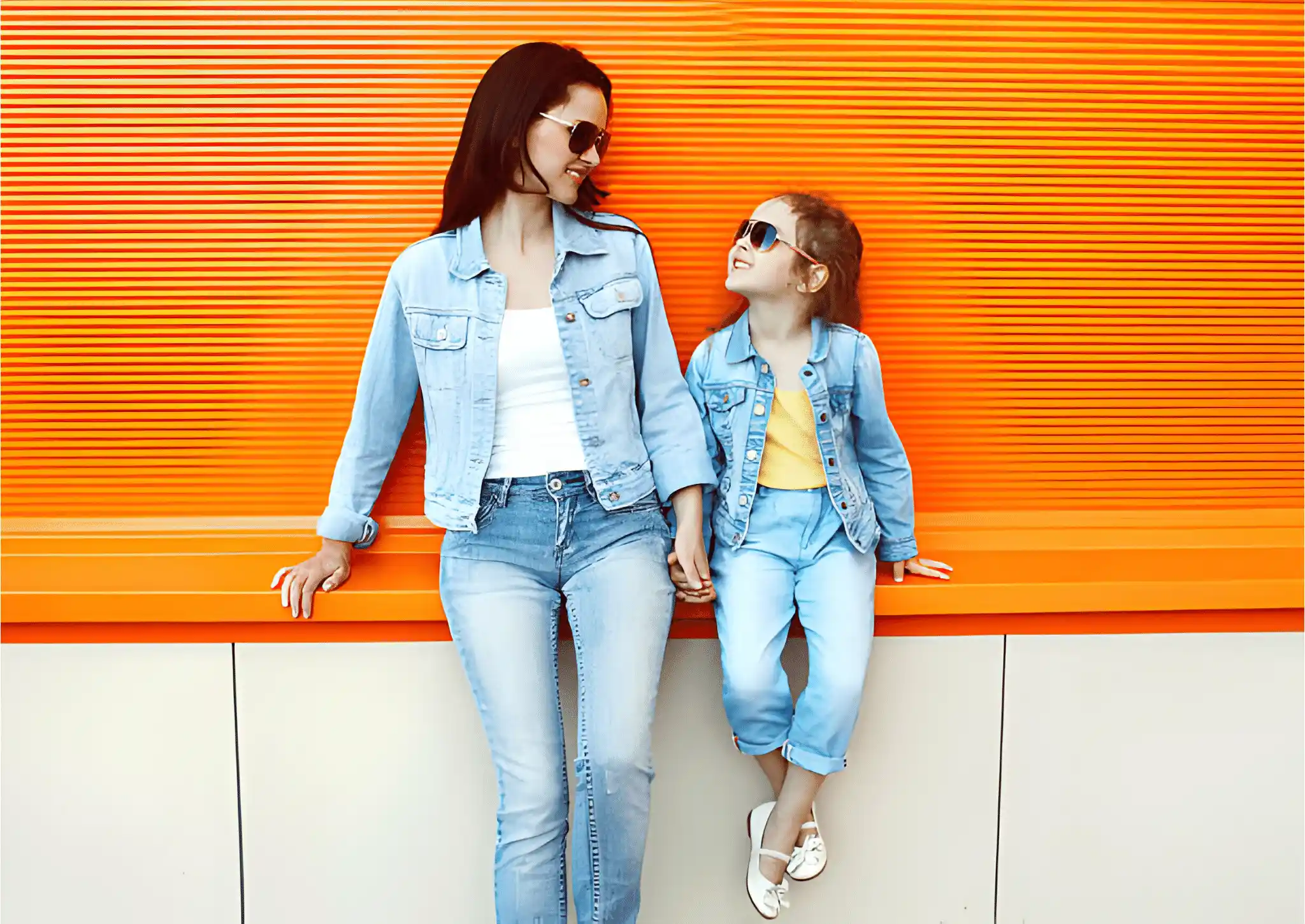 A little girl and mother dressed in denim.